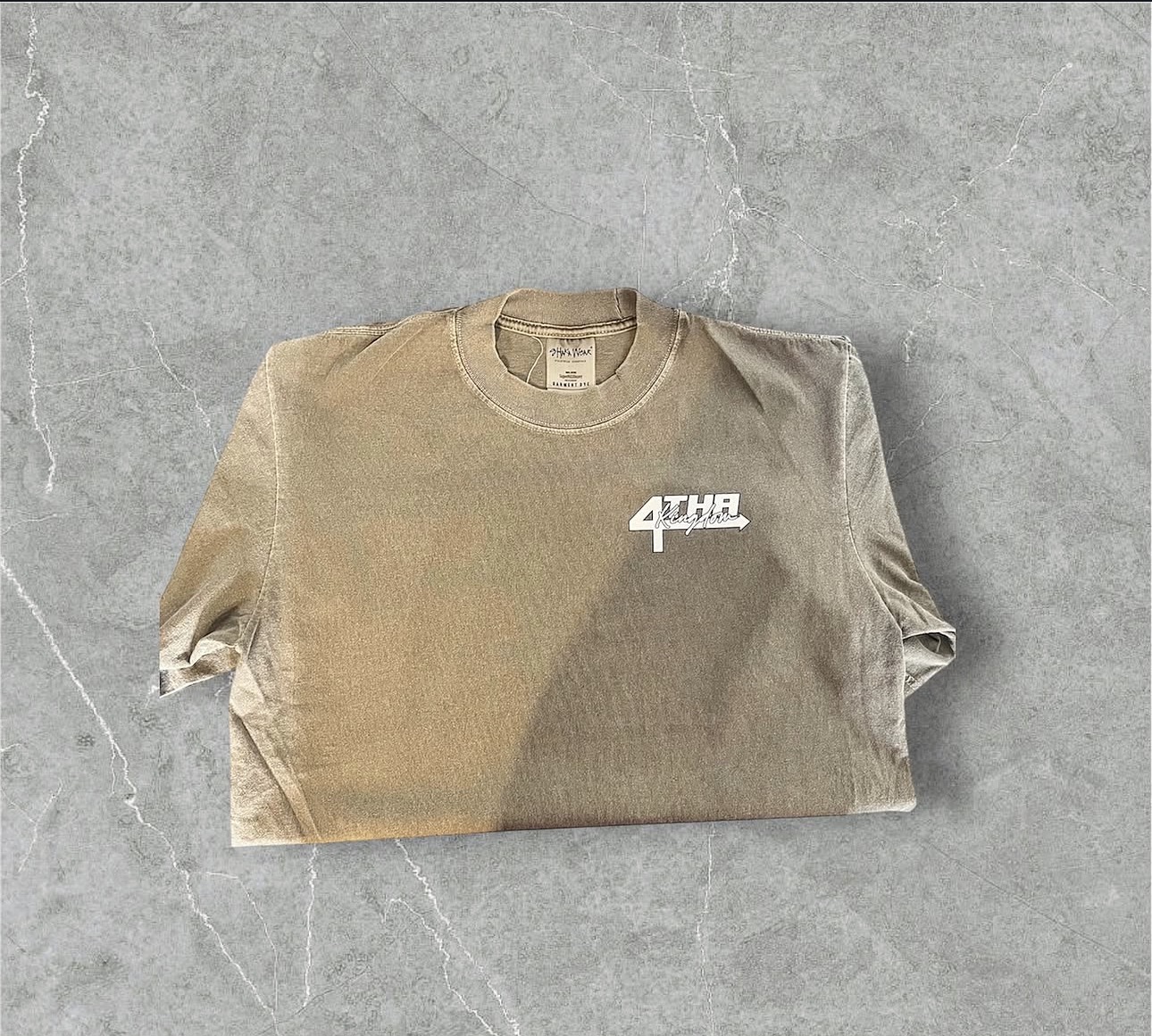 Sand colored garment dye tee with the 4 Tha Kingdom chest logo